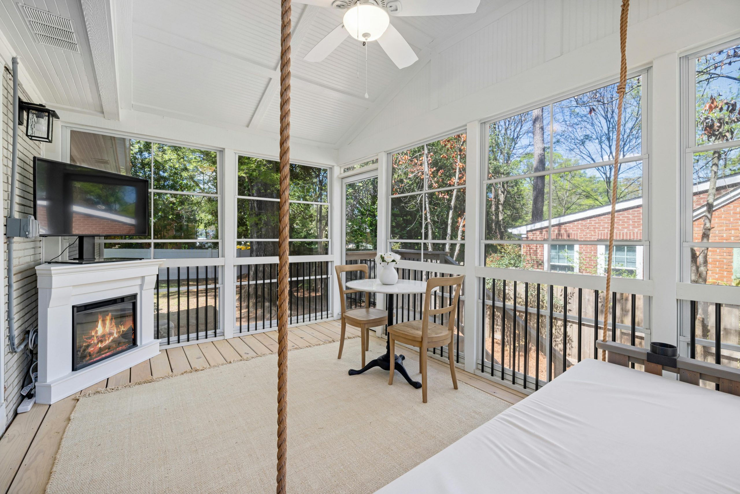 four-season room with wood flooring